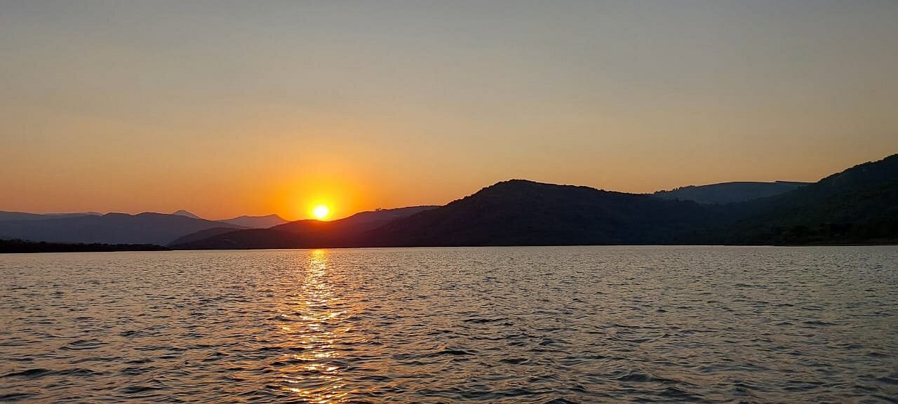 View over Maguga Dam-like landscape at sunset